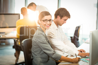 Portrait of businesswoman having a discussion with coworker