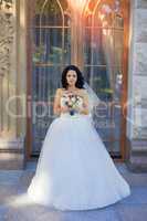 Brunette bride in a white dress