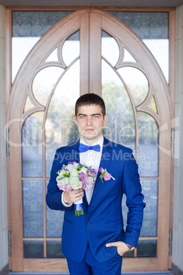 Stylish bride in a blue suit