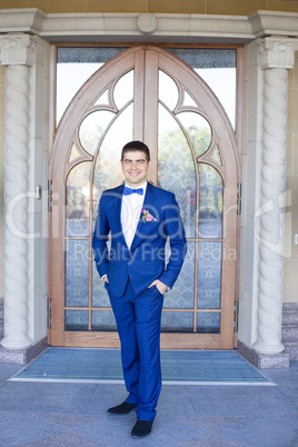 Stylish bride in a blue suit