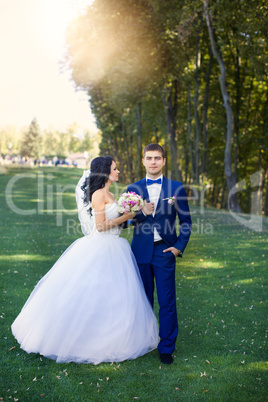 The bride and groom for a walk