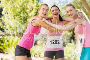 Portrait of young athlete women forming huddles