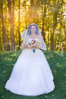 Brunette bride in a white dress