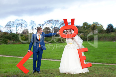 The happy newlyweds on a walk