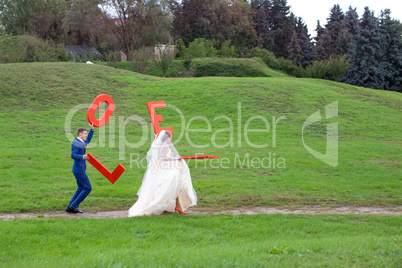 The happy newlyweds on a walk