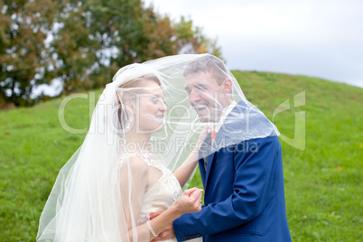 The happy newlyweds on a walk