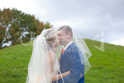 The happy newlyweds on a walk