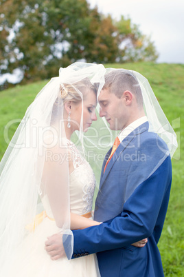 The happy newlyweds on a walk