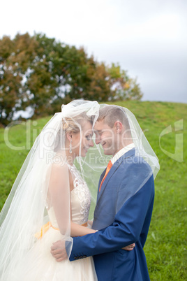 The happy newlyweds on a walk