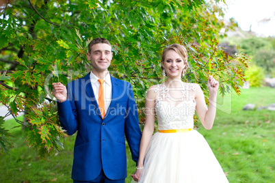 The happy newlyweds on a walk