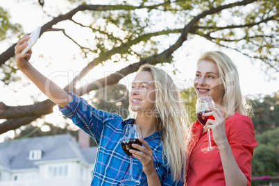 Beautiful women taking a selfie from mobile phone