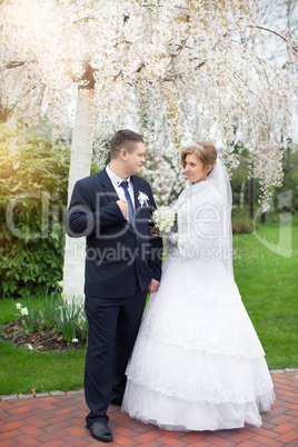 Walking bride and groom in nature