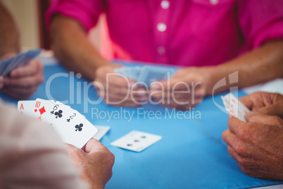 Retired people playing card