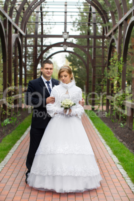 Walking bride and groom in nature