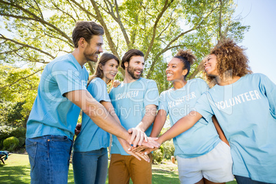 Group of volunteer forming hands stack