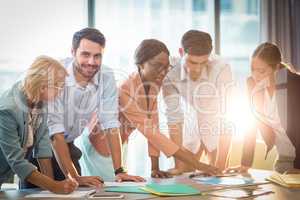 Group of business people discussing at desk