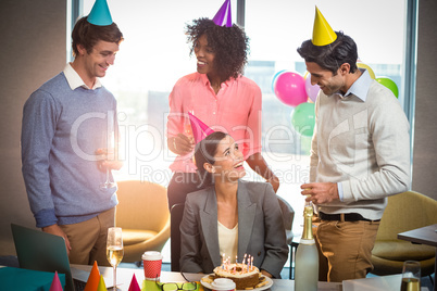 Business people celebrating birthday