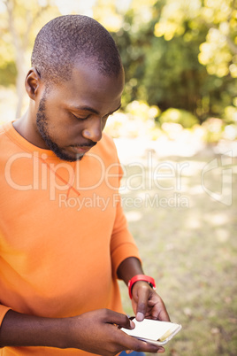 Happy man texting on the phone