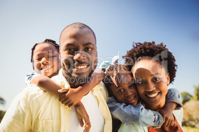 Couple posing together with their children