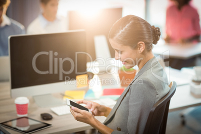 Businesswoman using mobile phone