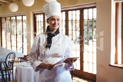 Chef holding a document