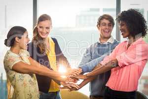 Business people forming hands stack