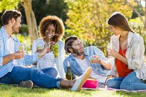 Group of friends having wine with breakfast