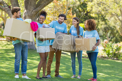 Group of volunteer holding cartons