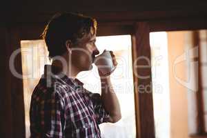 Man drinking a coffee alone
