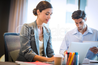 Businesswoman working on laptop