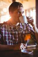 Man drinking a cup of coffee