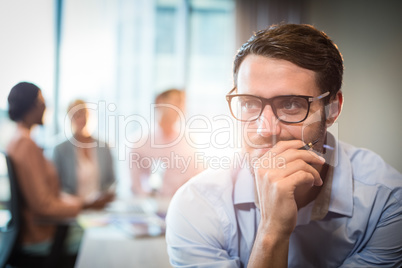 Thoughtful man with hand on chin