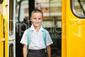 Portrait of schoolgirl looking from bus