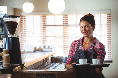 Waitress holding coffees