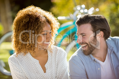 Couple smiling in park