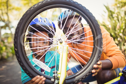 Family repairing a bike