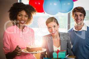 Portrait of business people celebrating birthday