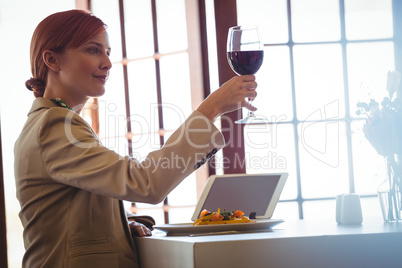 Woman holding a red wine