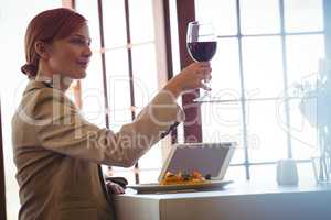 Woman holding a red wine