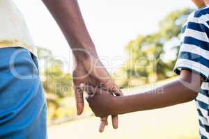 Focus on hands of son and father