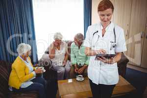 Portrait of a smiling nurse with seniors