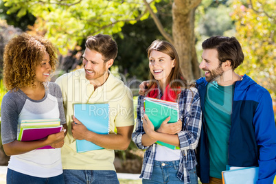 Group of college friends with the notes