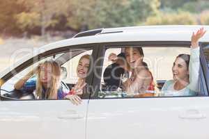 Beautiful women looking out from car window