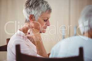 Side of a senior looking sad woman