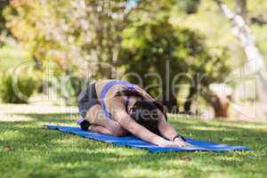 Woman doing yoga in park