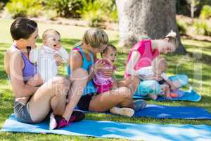 Women sitting with their babies