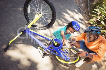 Family repairing a bike