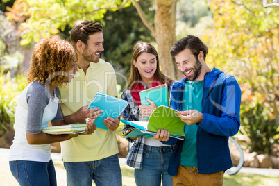 Group of college friends discussing the notes