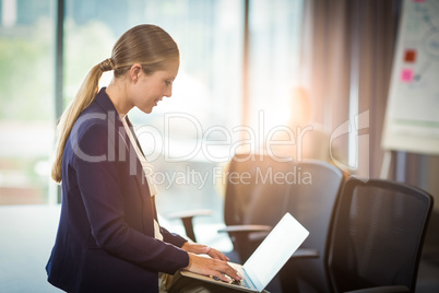 Businesswoman using laptop