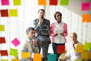 Business people looking at adhesive notes